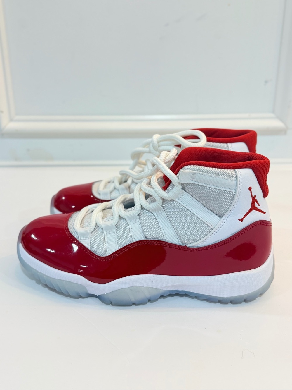 Air Jordan 11 Retro White and Red High-Top Sneakers